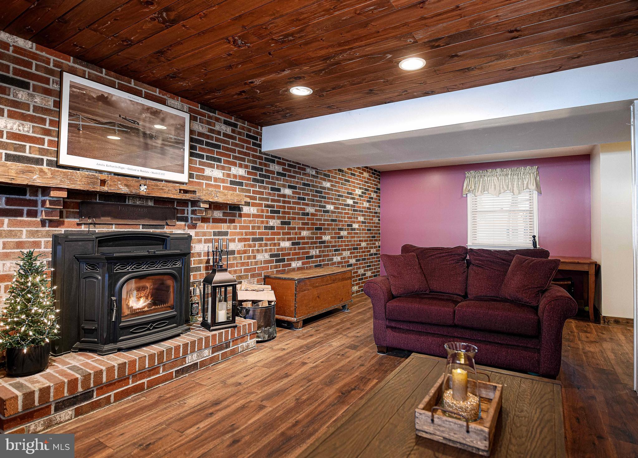 3204 Hunt Road Fallston, MD 21047 - Photo 27 of 54 a living room with furniture a fireplace and wooden floor
