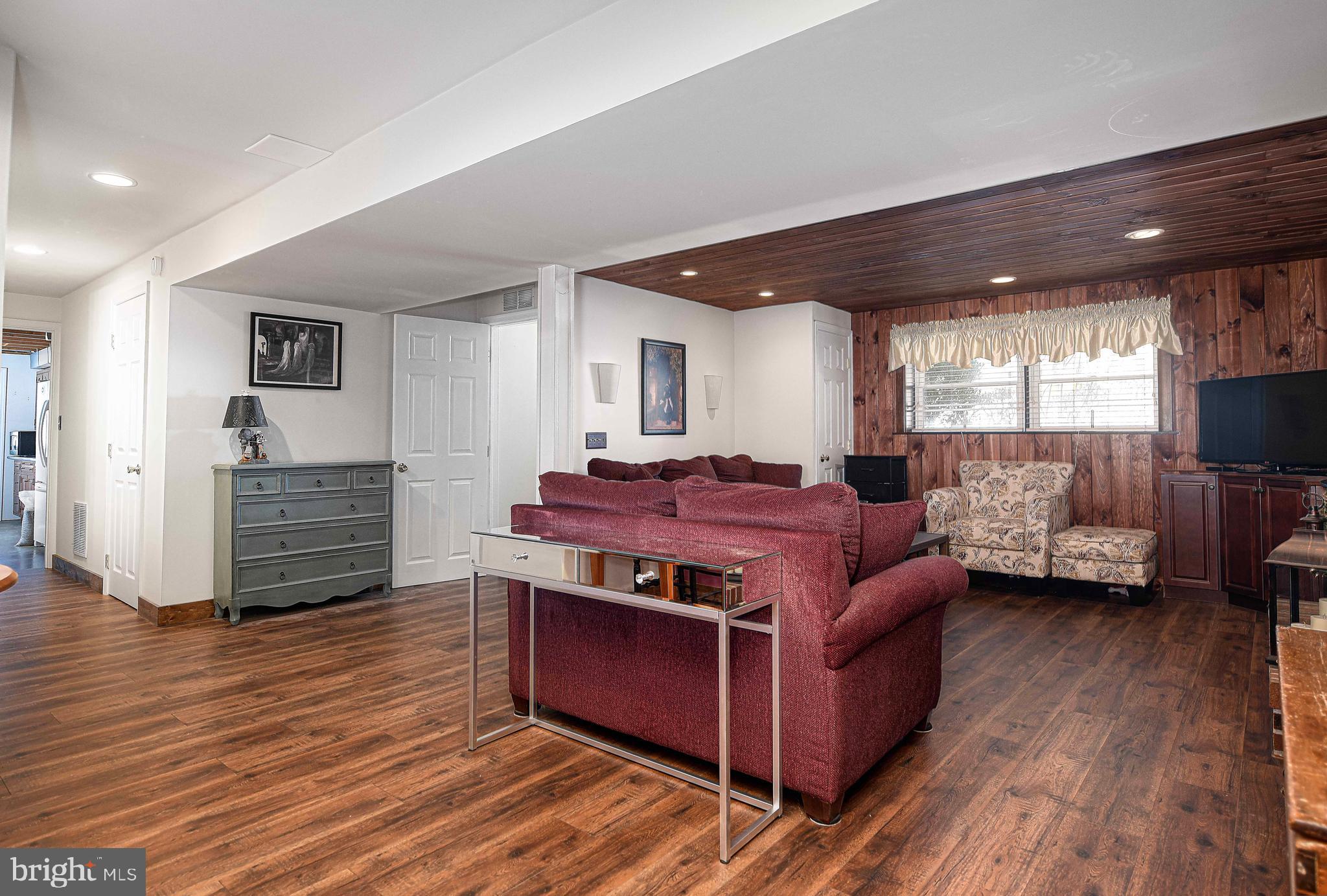3204 Hunt Road Fallston, MD 21047 - Photo 29 of 54 a living room with furniture a flat screen tv and a wooden floor
