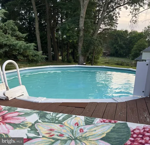 a view of a swimming pool with a lounge chairs