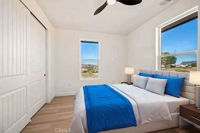 a bedroom with bed and window