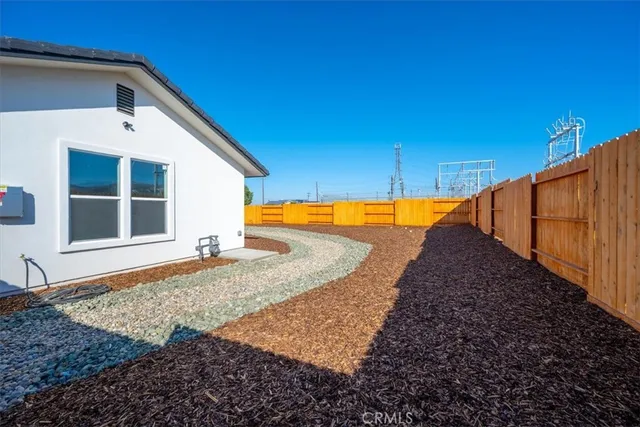 a view of a backyard of a house