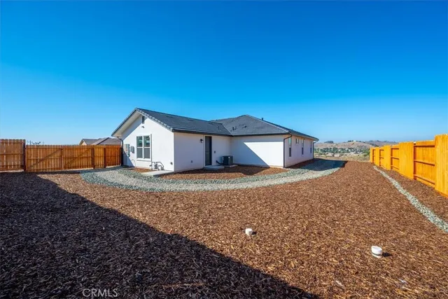 a house view with a backyard space
