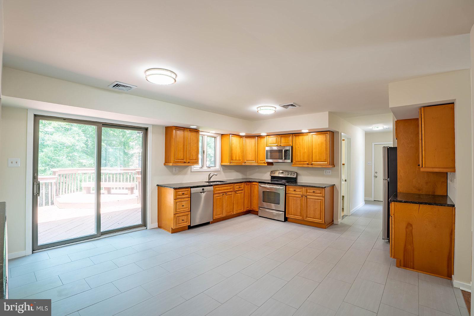 491 Kings Road Yardley, PA 19067 - Photo 14 of 52 a large kitchen with a large window and kitchen view