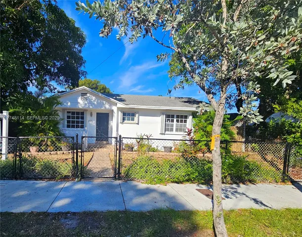 a kitchen with stainless steel appliances a refrigerator sink and cabinets