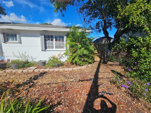 a kitchen with a stove and white cabinets