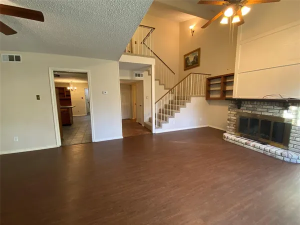 an entryway and hall with wooden floor