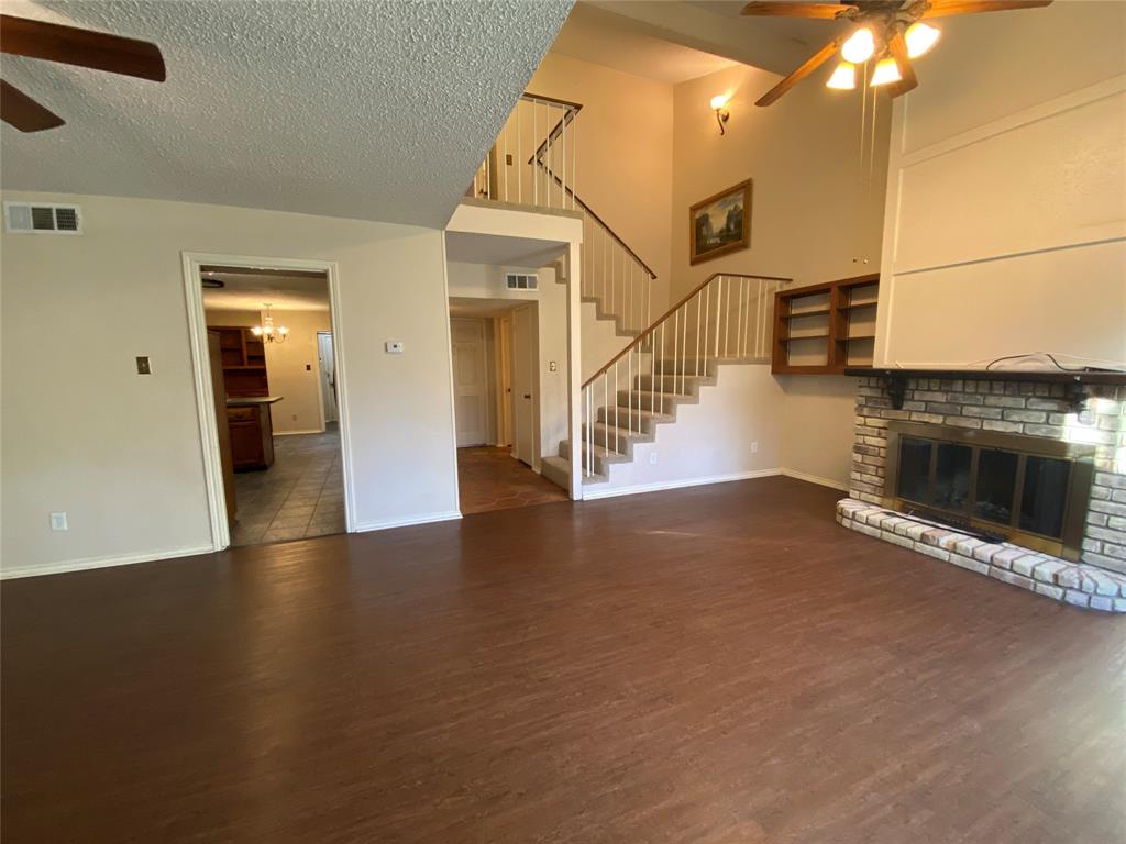 606 Old Country Road Duncanville, TX 75137 - Photo 6 of 22 an entryway and hall with wooden floor