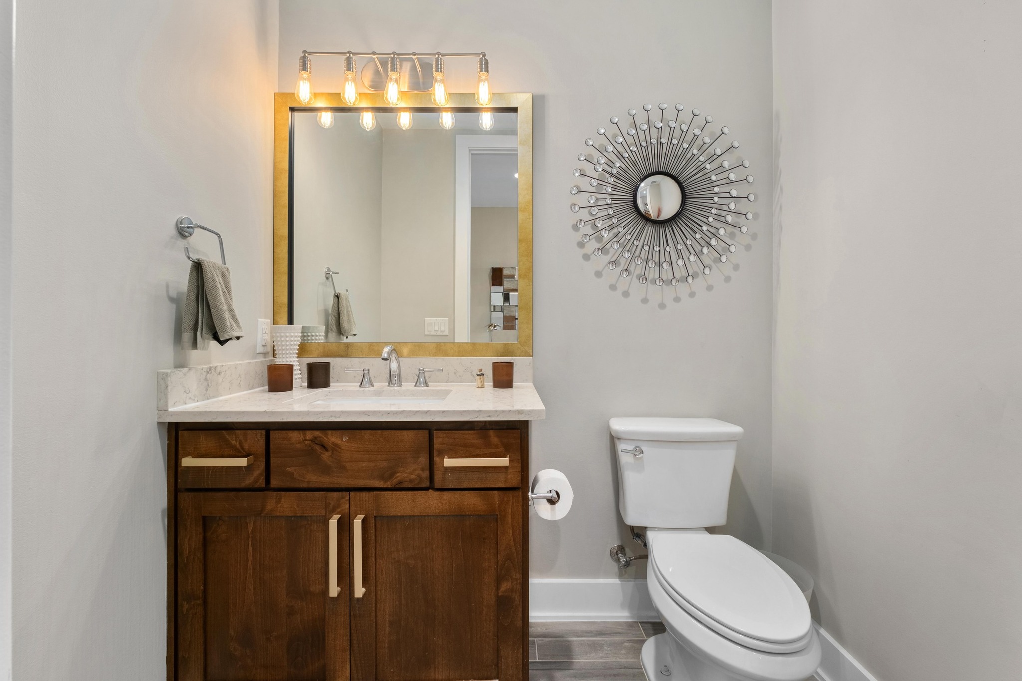 3302 Funston Street Austin, TX 78703 - Photo 11 of 35 Half bathroom featuring vanity and wood finished floors