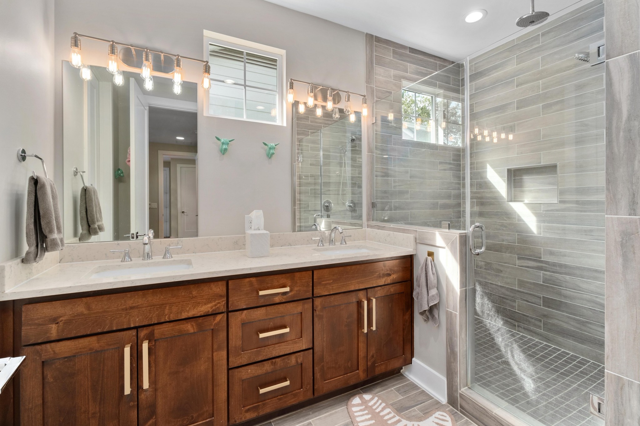 3302 Funston Street Austin, TX 78703 - Photo 15 of 35 Bathroom with double vanity, a shower stall, and recessed lighting