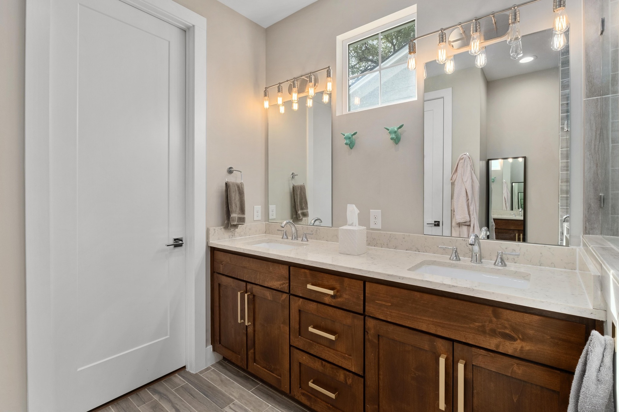3302 Funston Street Austin, TX 78703 - Photo 16 of 35 Bathroom with double vanity and wood finish floors