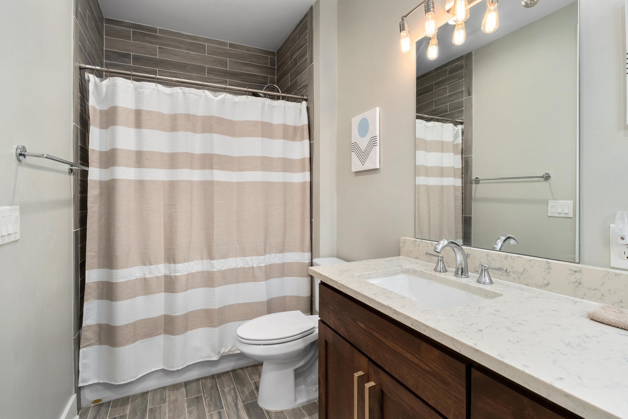 3302 Funston Street Austin, TX 78703 - Photo 23 of 35 Full bathroom with vanity and wood finish floors