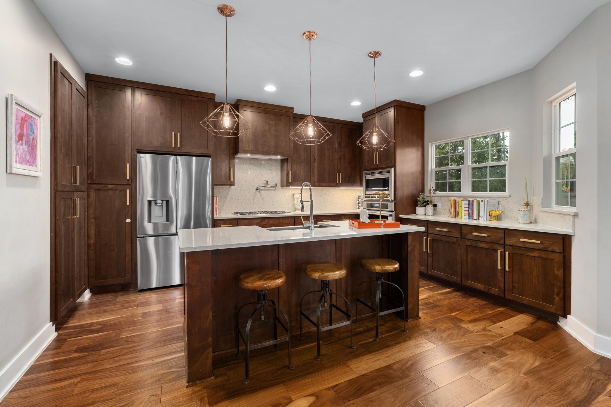 3302 Funston Street Austin, TX 78703 - Photo 6 of 35 Kitchen with tasteful backsplash, appliances with stainless steel finishes, decorative light fixtures, a breakfast bar, and recessed lighting