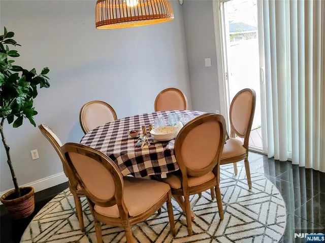a view of a chairs and table in the balcony