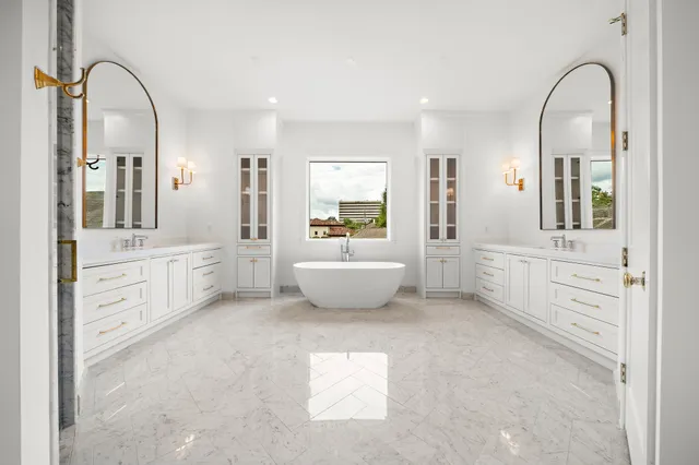 a kitchen with stainless steel appliances granite countertop a stove and cabinets