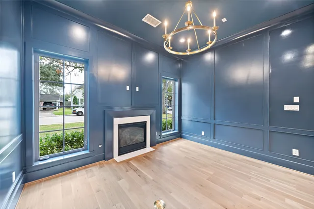 a kitchen with a sink a refrigerator and cabinets