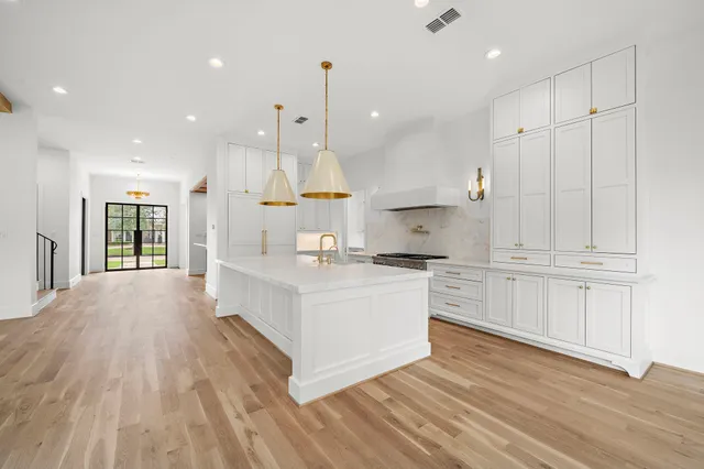 a view of an empty room with a fireplace and a window