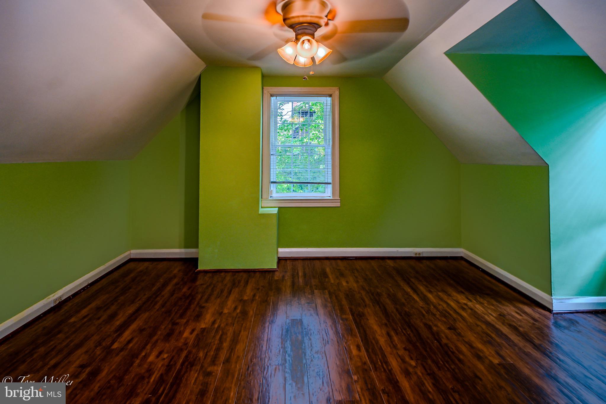 5815 Lochlea Road Baltimore, MD 21209 - Photo 18 of 40 a view of a room with wooden floors and a window