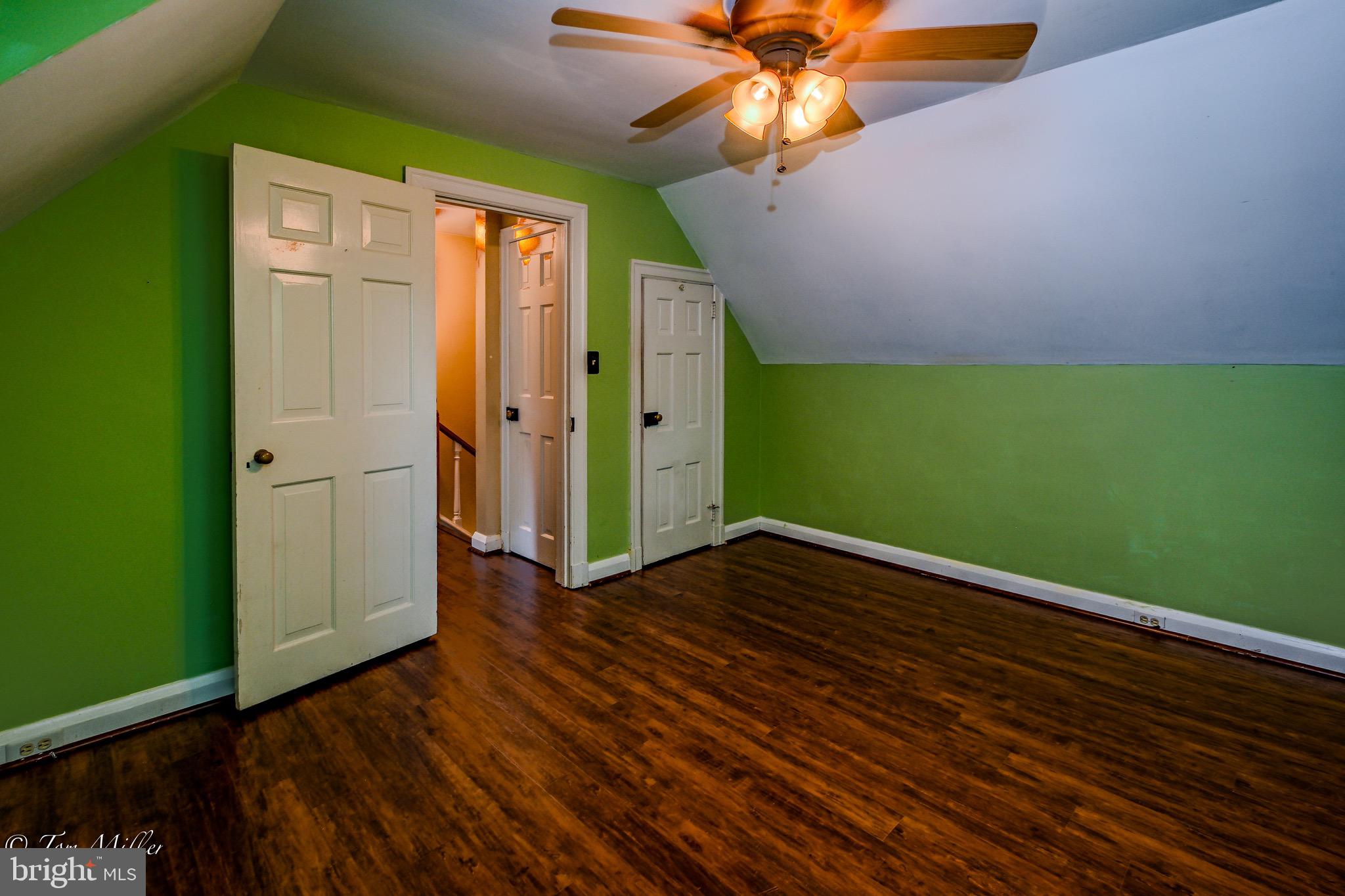5815 Lochlea Road Baltimore, MD 21209 - Photo 19 of 40 wooden floor in an empty room with a window
