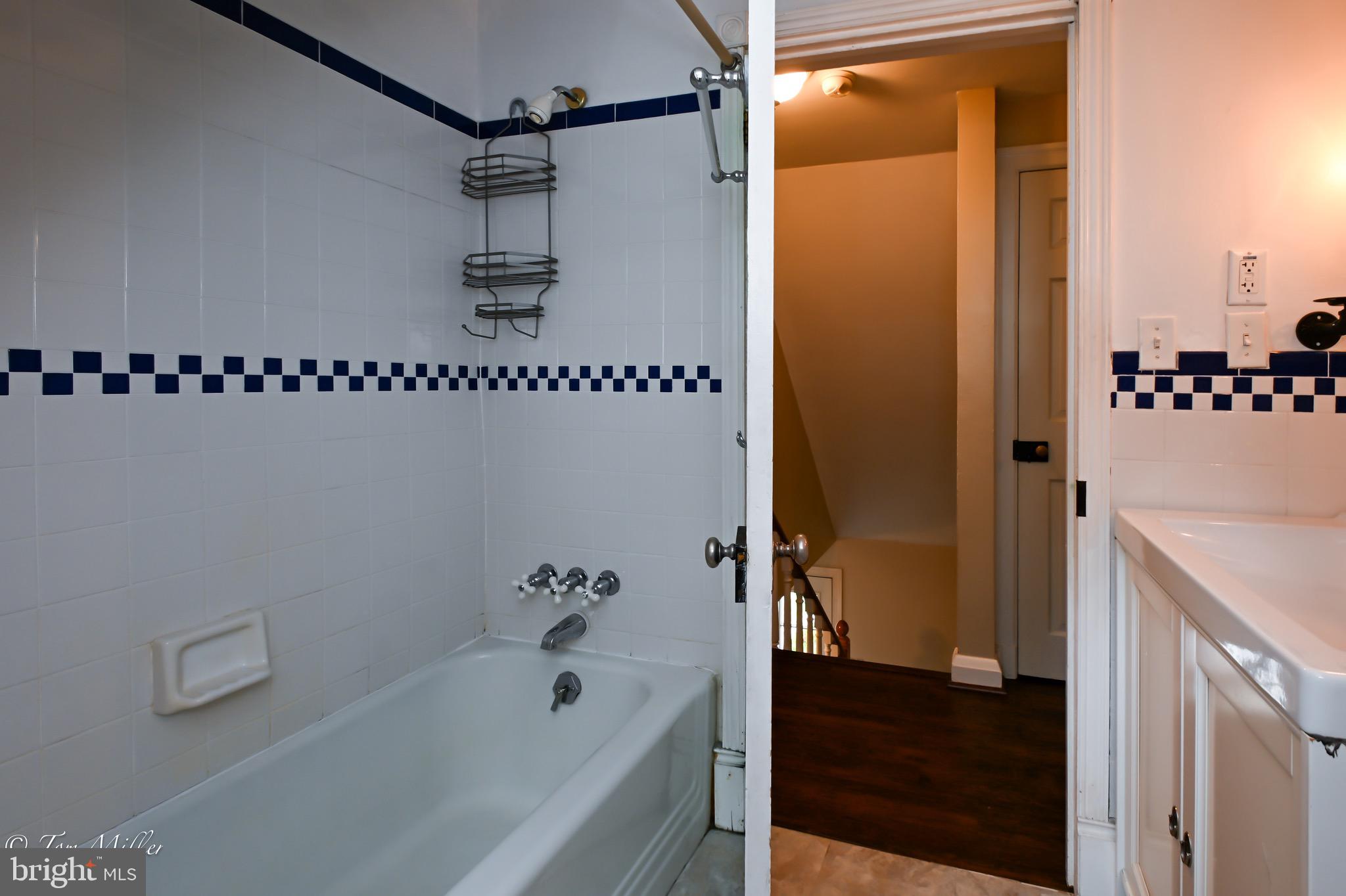 5815 Lochlea Road Baltimore, MD 21209 - Photo 21 of 40 a bathroom with a tub and a shower