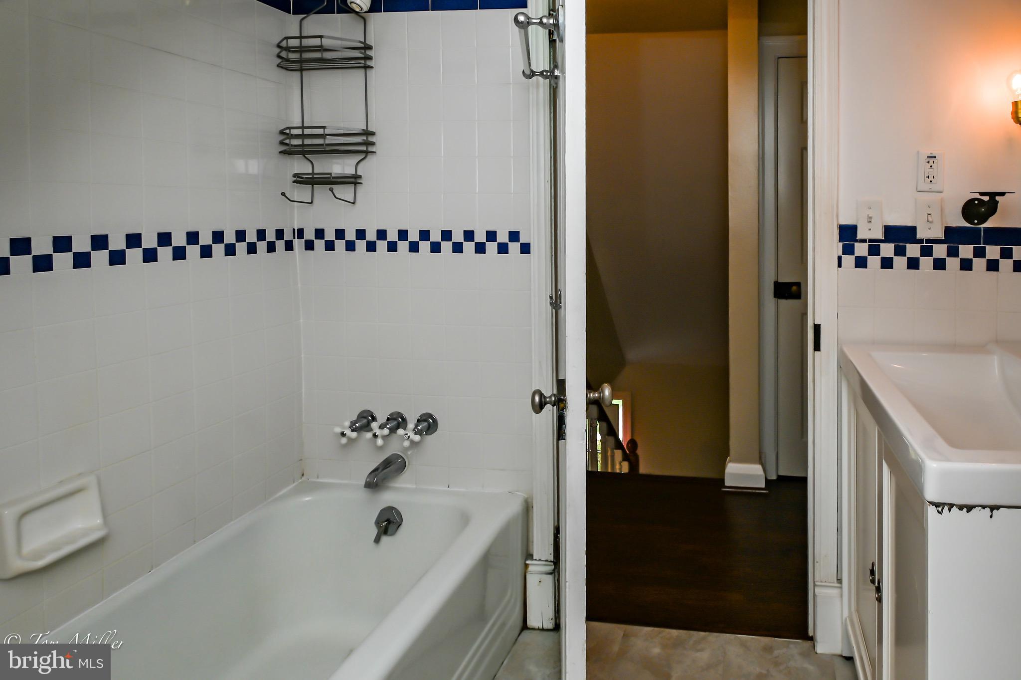 5815 Lochlea Road Baltimore, MD 21209 - Photo 22 of 40 a bathroom with a bathtub and shower