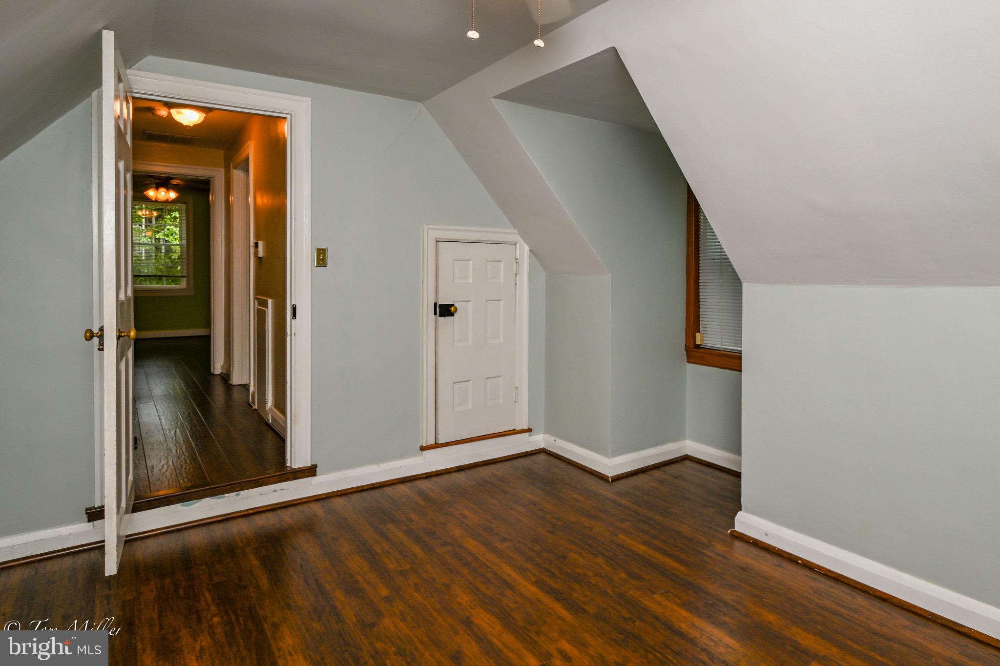 5815 Lochlea Road Baltimore, MD 21209 - Photo 24 of 40 an empty room with wooden floor and entrance