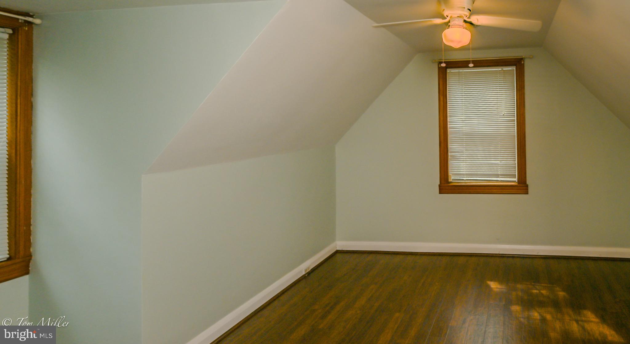 5815 Lochlea Road Baltimore, MD 21209 - Photo 25 of 40 a view of a room with wooden floor and a window