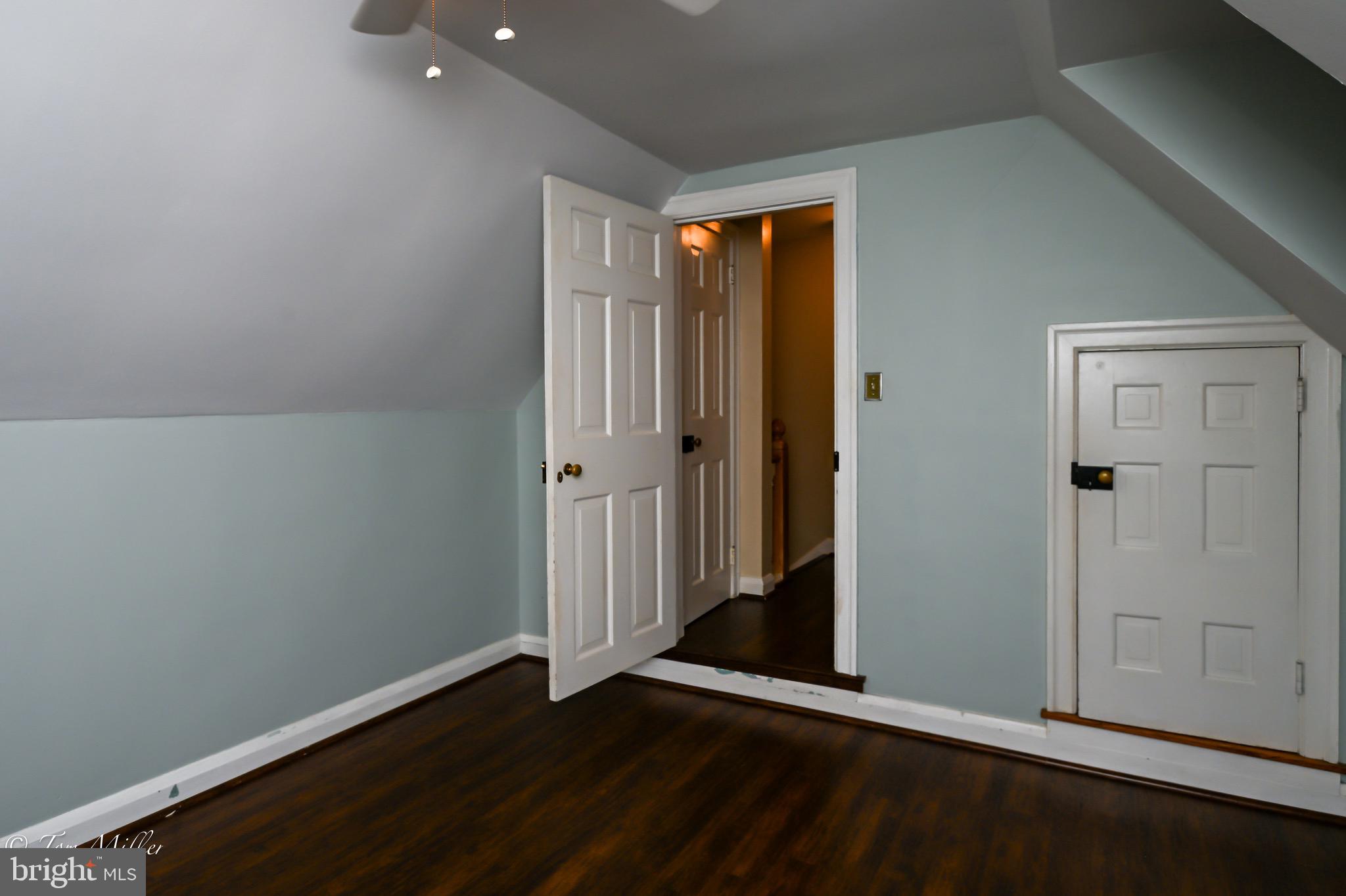 5815 Lochlea Road Baltimore, MD 21209 - Photo 26 of 40 an empty room with wooden floor and closet