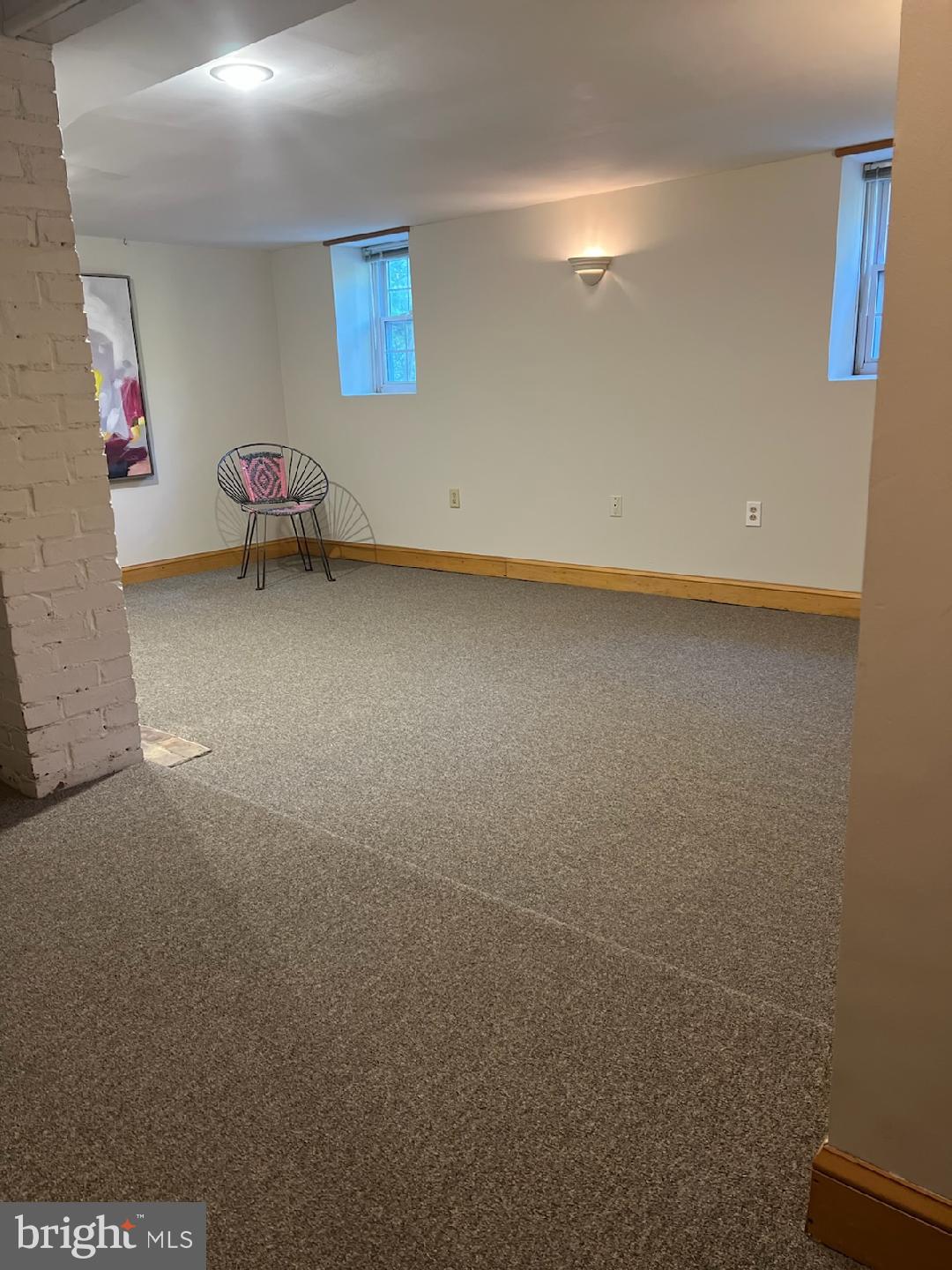 5815 Lochlea Road Baltimore, MD 21209 - Photo 28 of 40 a view of a livingroom with wooden floor and lounge chairs