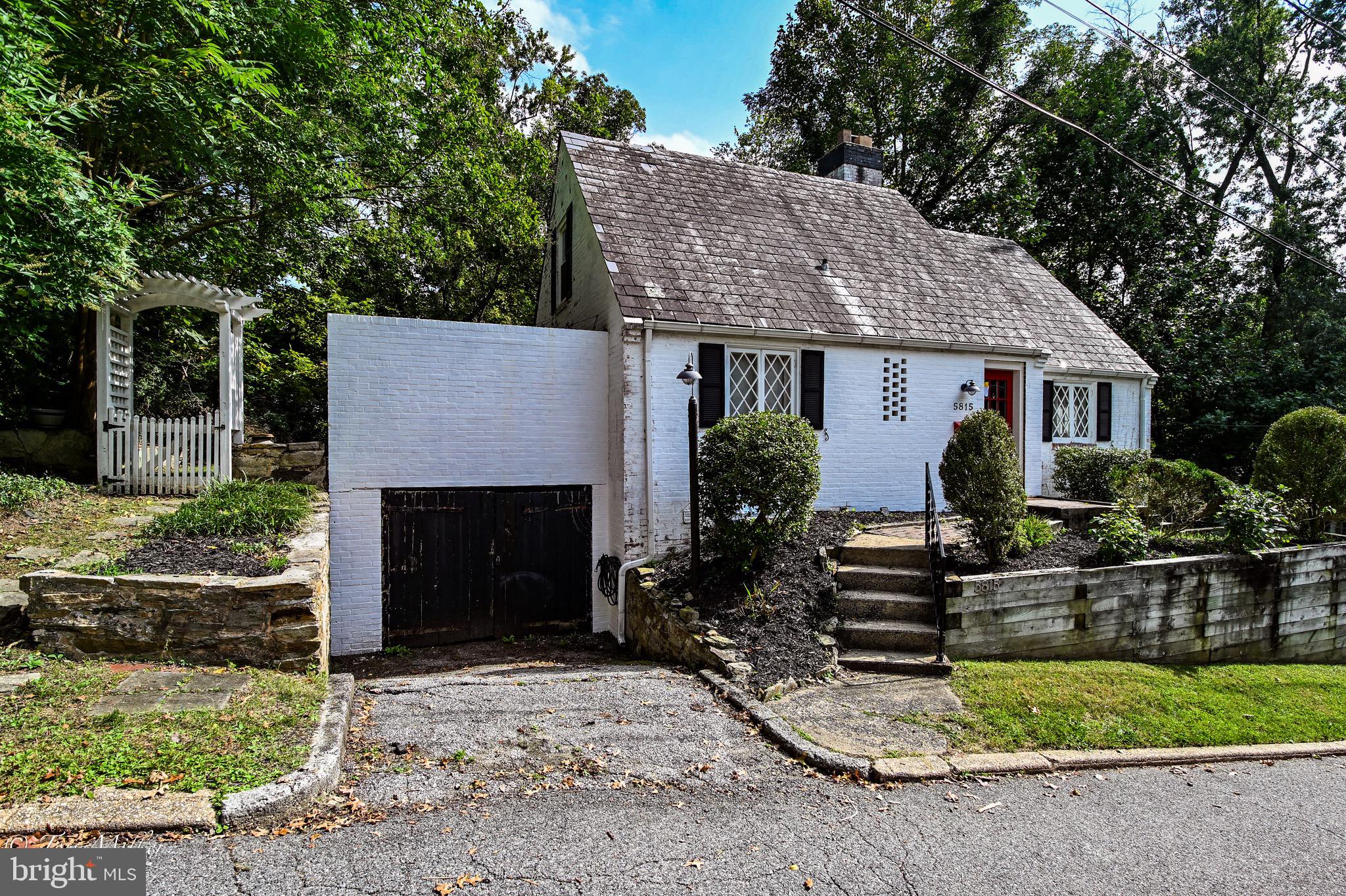 5815 Lochlea Road Baltimore, MD 21209 - Photo 32 of 40 a front view of house with seating space and yard
