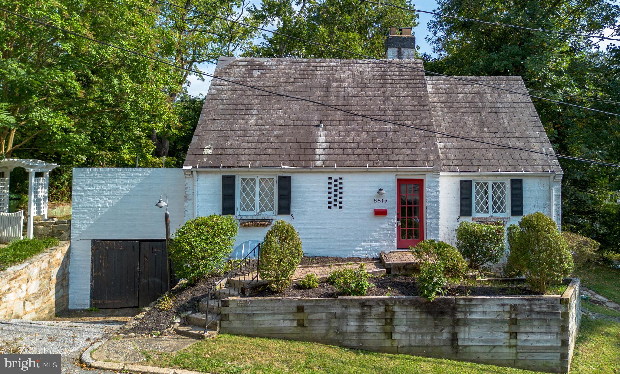 5815 Lochlea Road Baltimore, MD 21209 - Photo 33 of 40 front view of house with potted plants