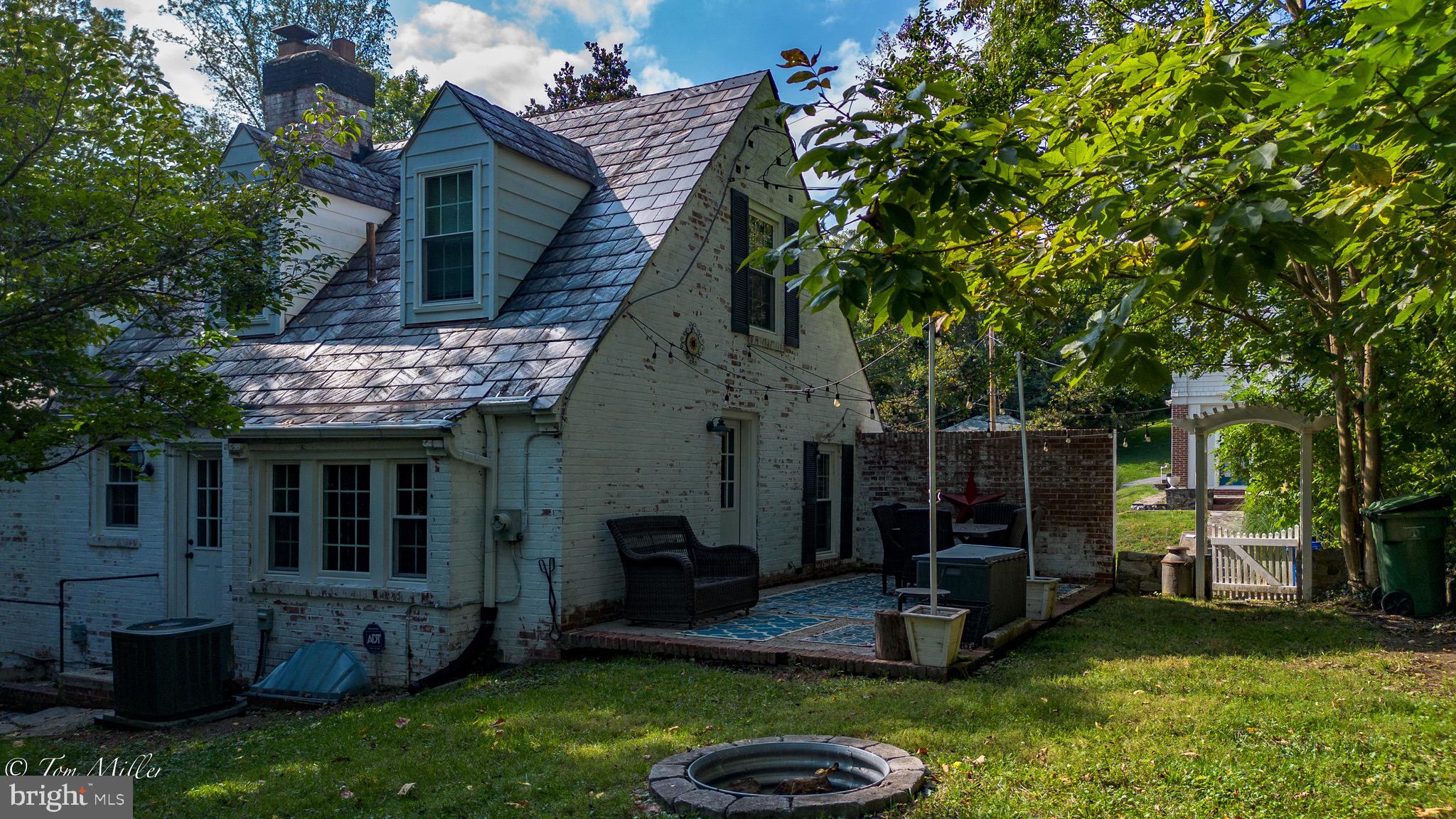 5815 Lochlea Road Baltimore, MD 21209 - Photo 35 of 40 a view of a house with backyard porch and sitting area