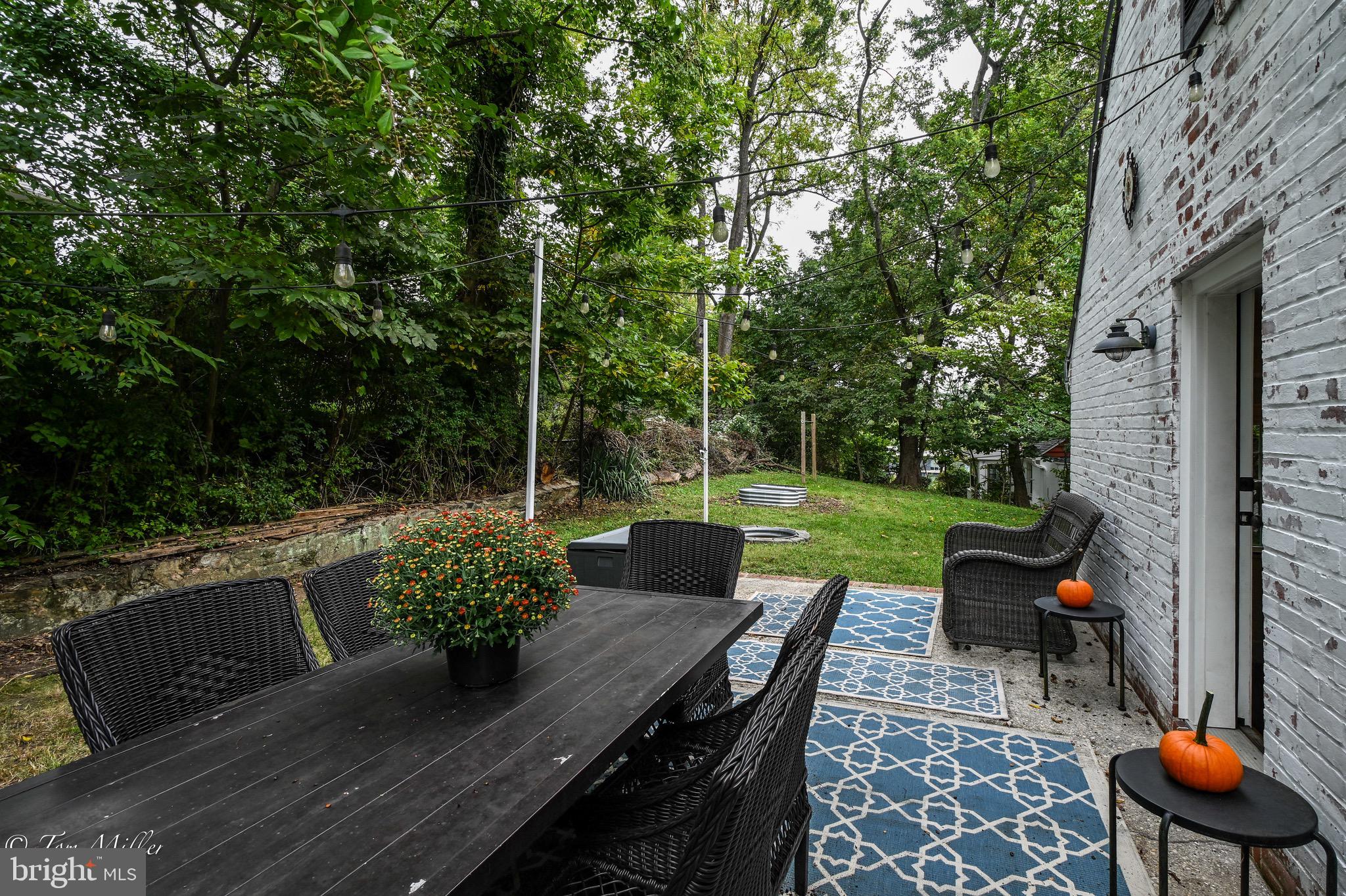 5815 Lochlea Road Baltimore, MD 21209 - Photo 38 of 40 a view of a wooden chairs and table in the patio