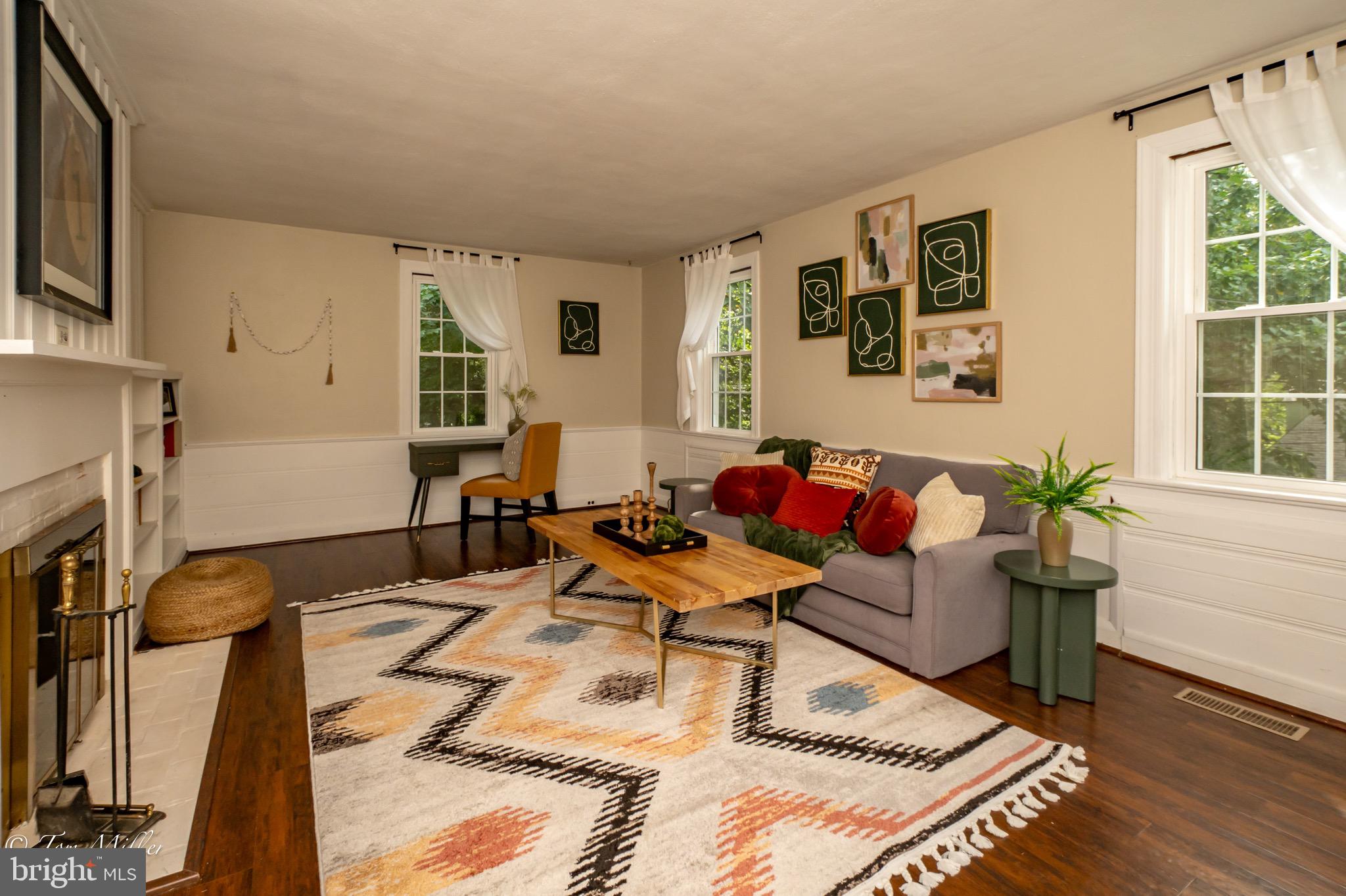 5815 Lochlea Road Baltimore, MD 21209 - Photo 6 of 40 a living room with furniture and a fireplace