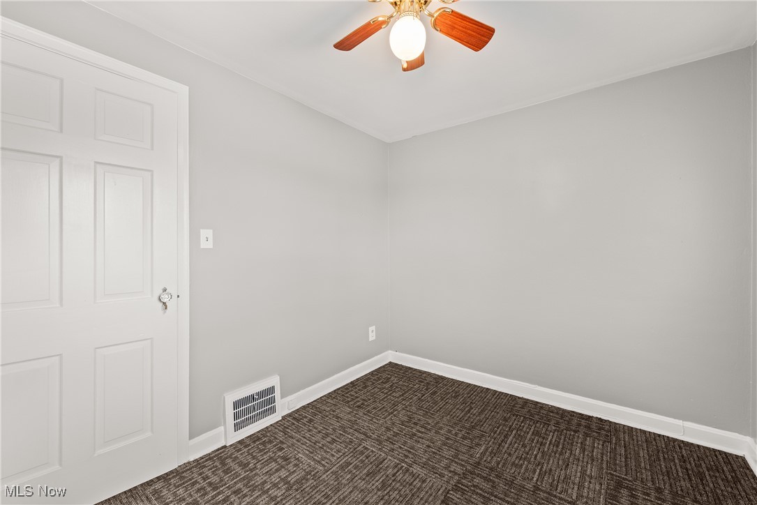 4041 Wilmington Road Cleveland, OH 44121 - Photo 17 of 38 Carpeted empty room featuring baseboards and a ceiling fan