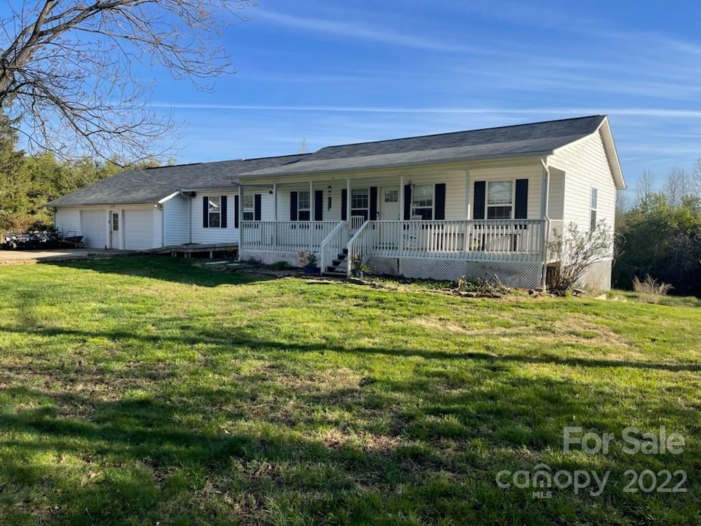 4030 Robinson Road Newton, NC 28658 - Photo 1 of 9 a front view of a house with a garden