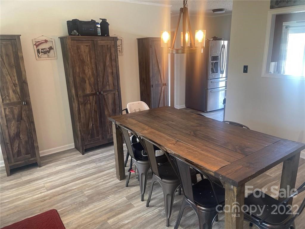 4030 Robinson Road Newton, NC 28658 - Photo 2 of 9 a view of a dining room with furniture and wooden floor