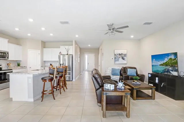 a living room with furniture and a large window