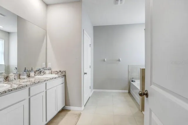 a bathroom with a shower and a sink