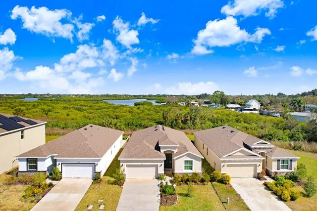 an aerial view of a house with a ocean view