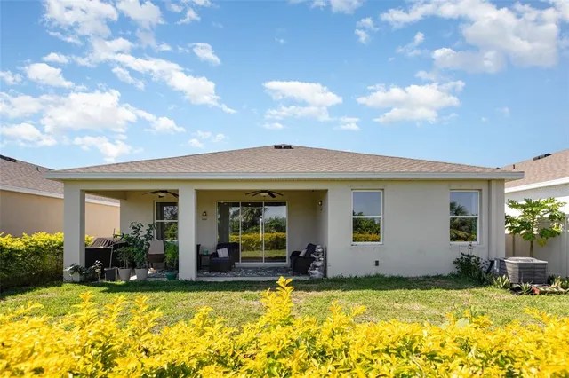 a aerial view of a house with a big yard