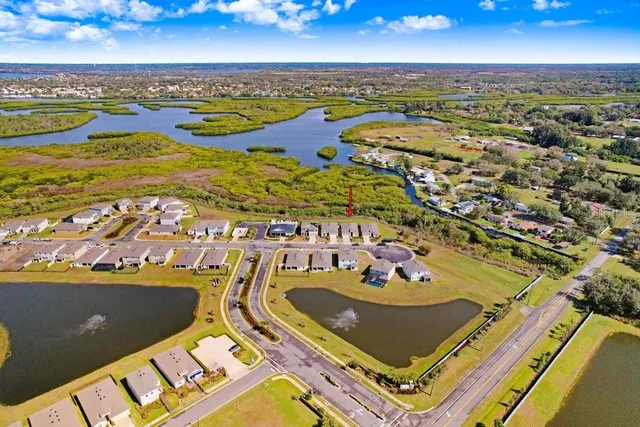 an aerial view of residential houses with outdoor space