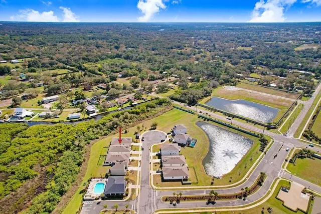 a view of a swimming pool with outdoor seating