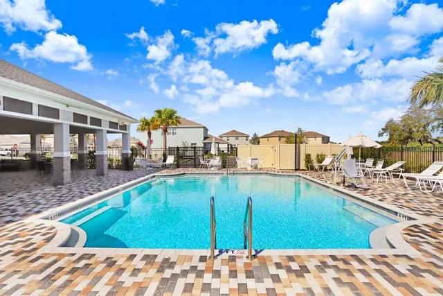 a living room with lots of furniture and a chandelier