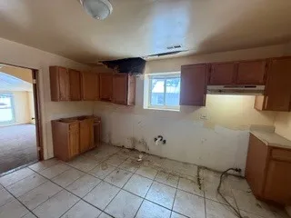a kitchen with a cabinets and window