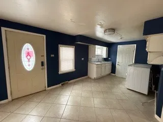 a kitchen with stainless steel appliances granite countertop a refrigerator and stove