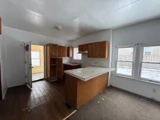 a kitchen that has a sink and a stove