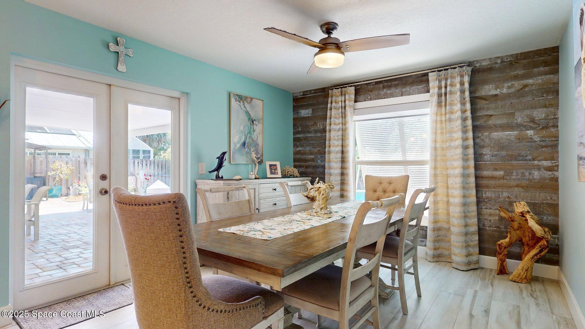 103 Matanzas Road Melbourne Beach, FL 32951 - Photo 16 of 37 a dining room with furniture window and wooden floor