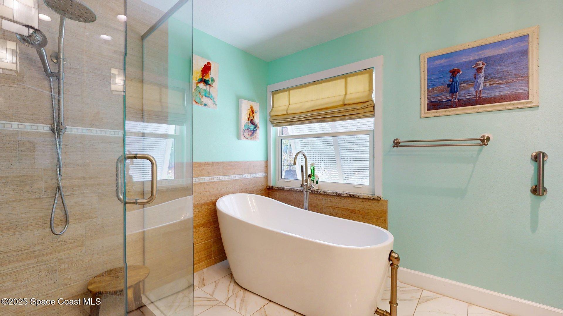 103 Matanzas Road Melbourne Beach, FL 32951 - Photo 19 of 37 a bathroom with a sink and mirror