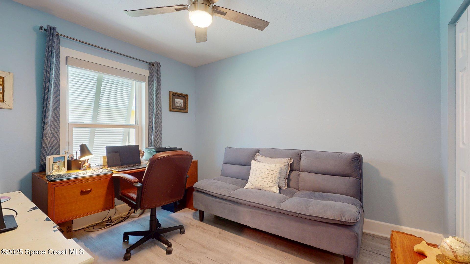 103 Matanzas Road Melbourne Beach, FL 32951 - Photo 23 of 37 a living room with furniture and a window