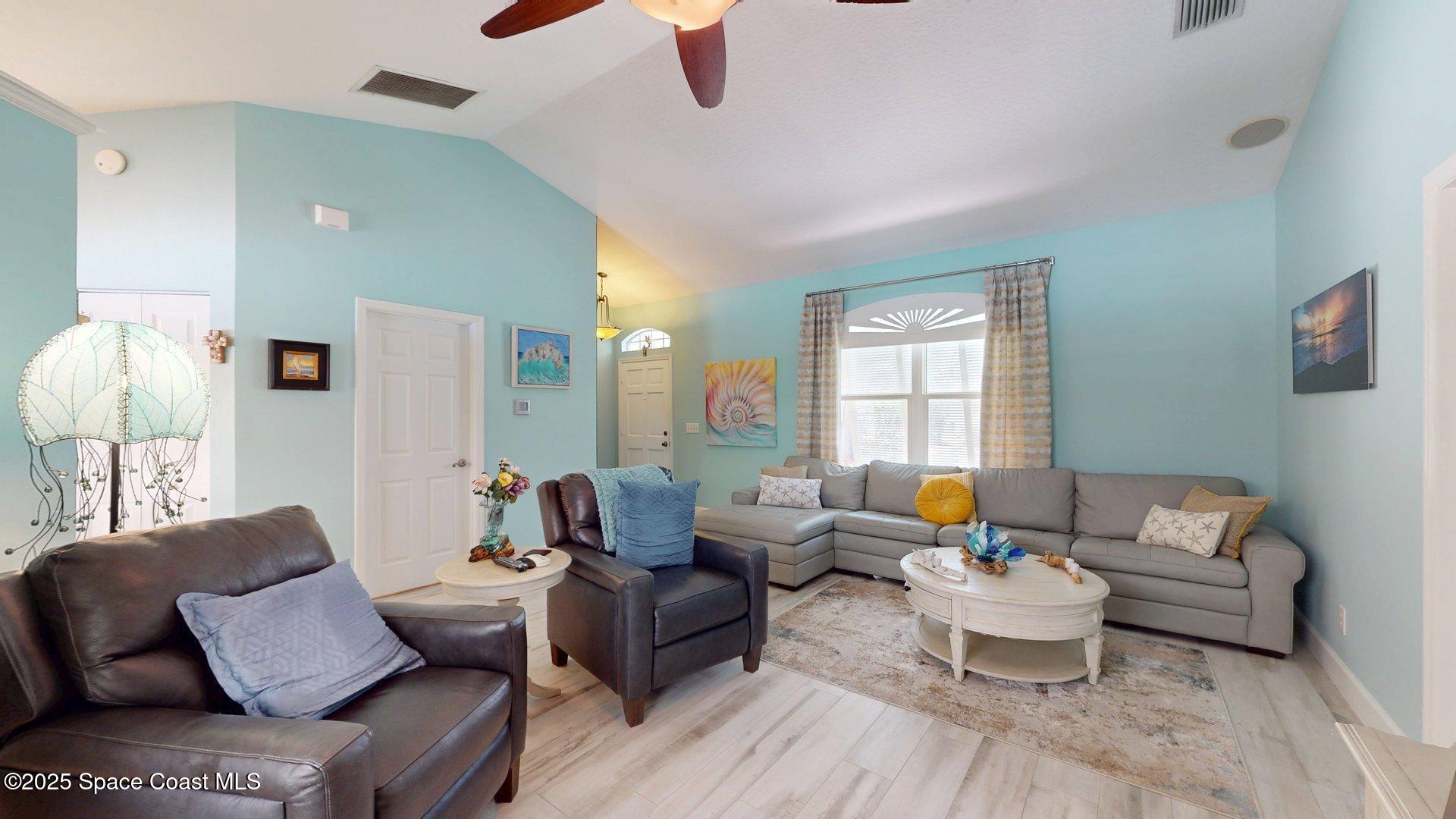 103 Matanzas Road Melbourne Beach, FL 32951 - Photo 27 of 37 a living room with furniture and a large window
